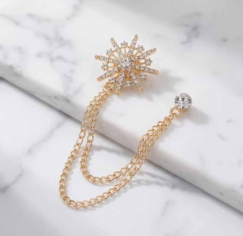 Golden chain brooch